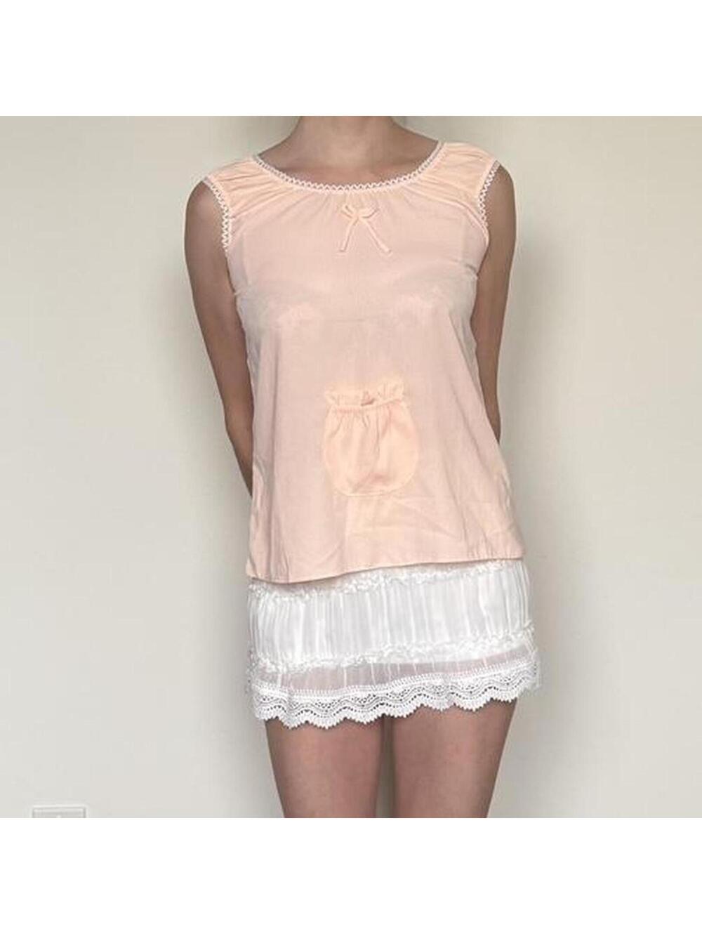 Gingham babydoll top with a pocket and boy. Best fits an XS.